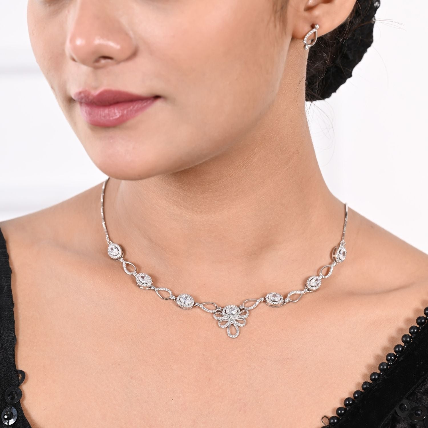 Linked halo-crystal necklace and earring set