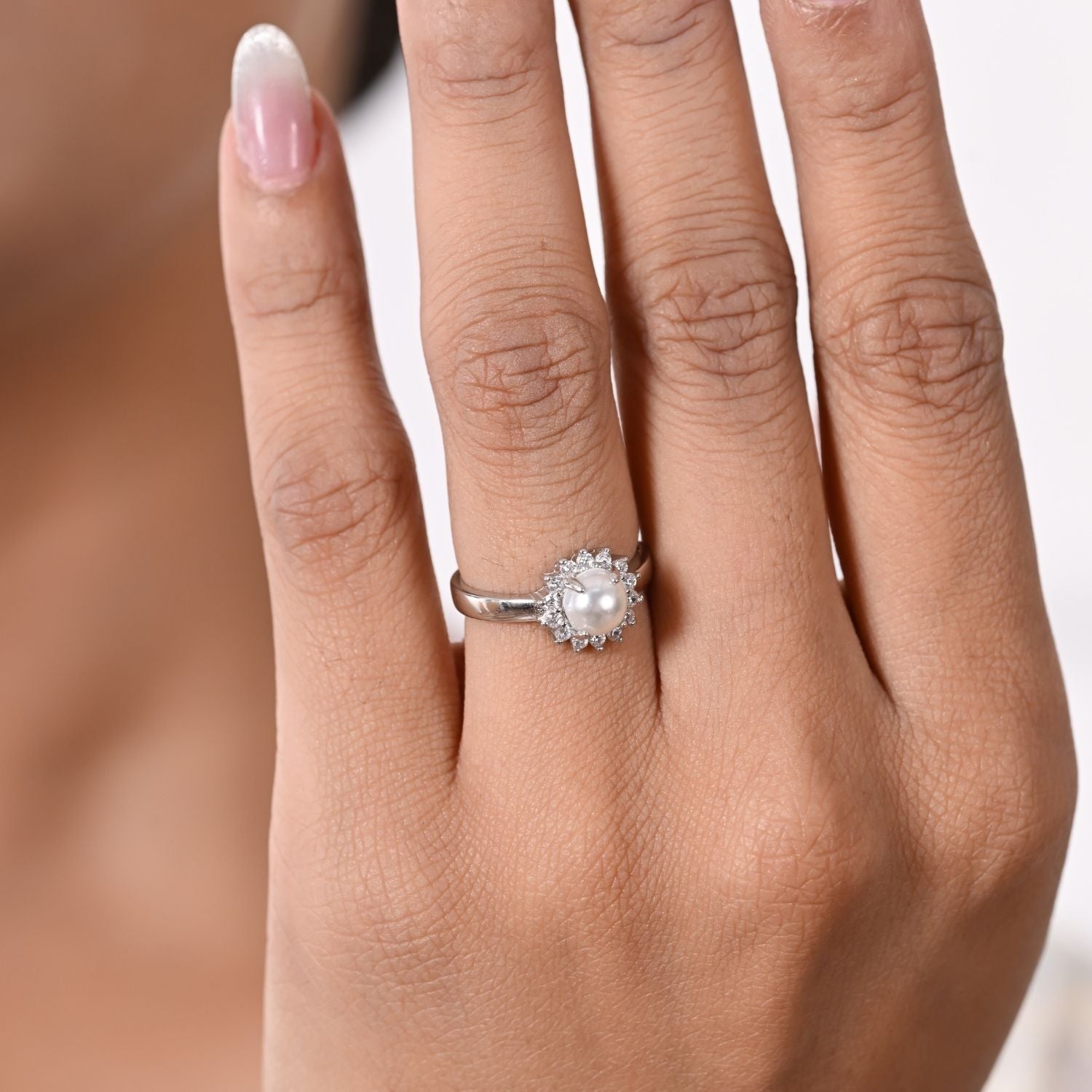 Pearl halo floral ring